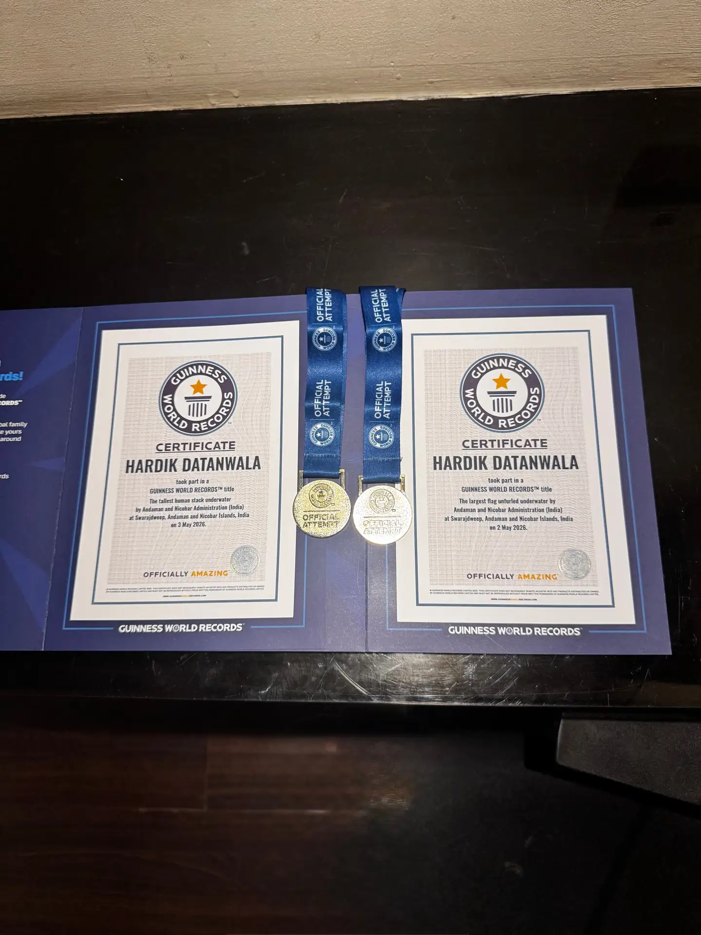 Both Guinness World Records certificates in Hardik Datanwala's name with their two official attempt medals